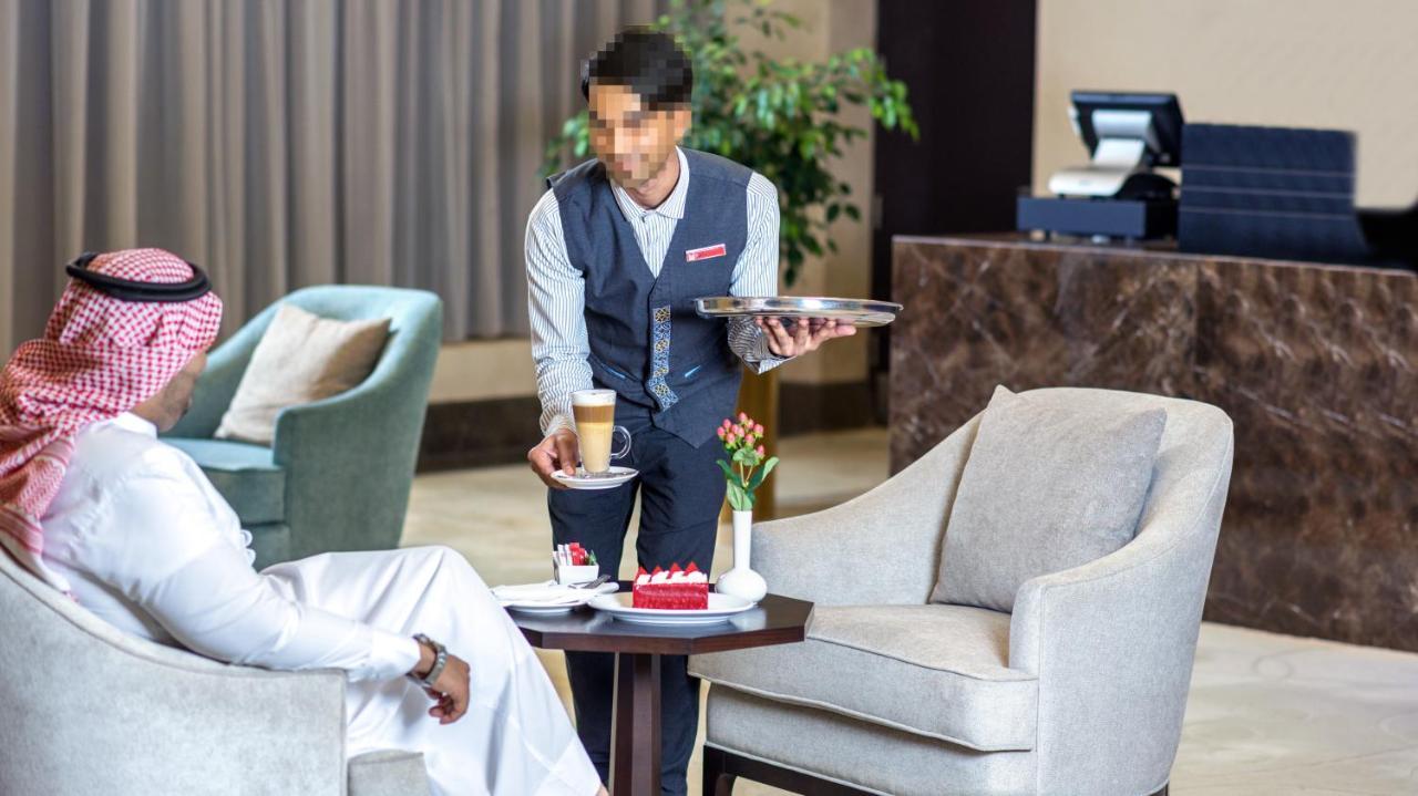 Grand Millennium Gizan Hotel Jizan Exterior photo A butler serving coffee