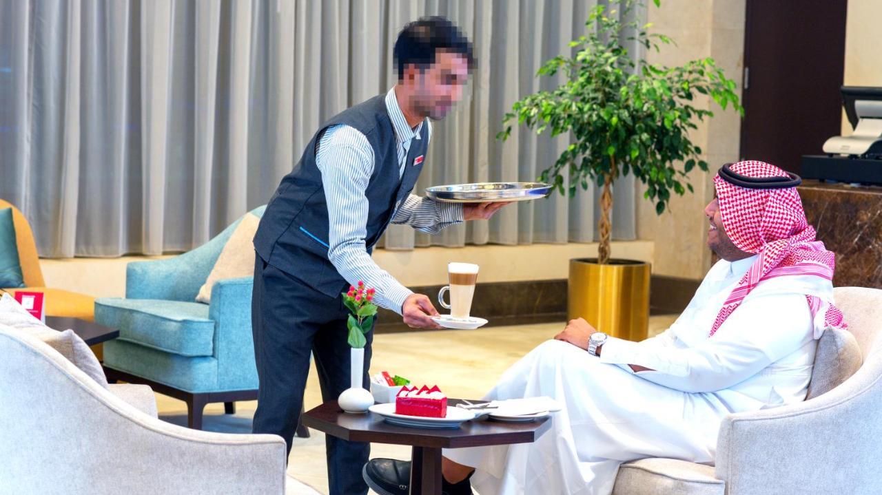 Grand Millennium Gizan Hotel Jizan Exterior photo A butler serving tea