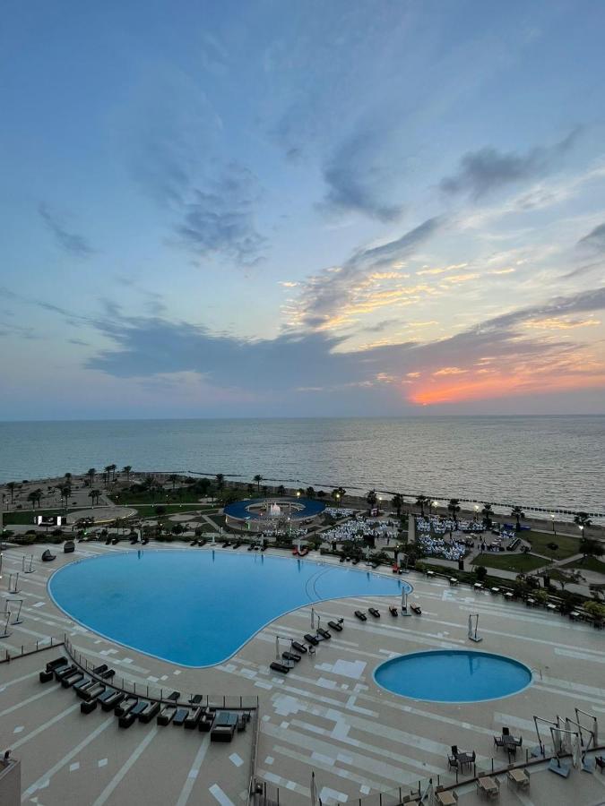 Grand Millennium Gizan Hotel Jizan Exterior photo Sunset at the beach of the Grand Hotel